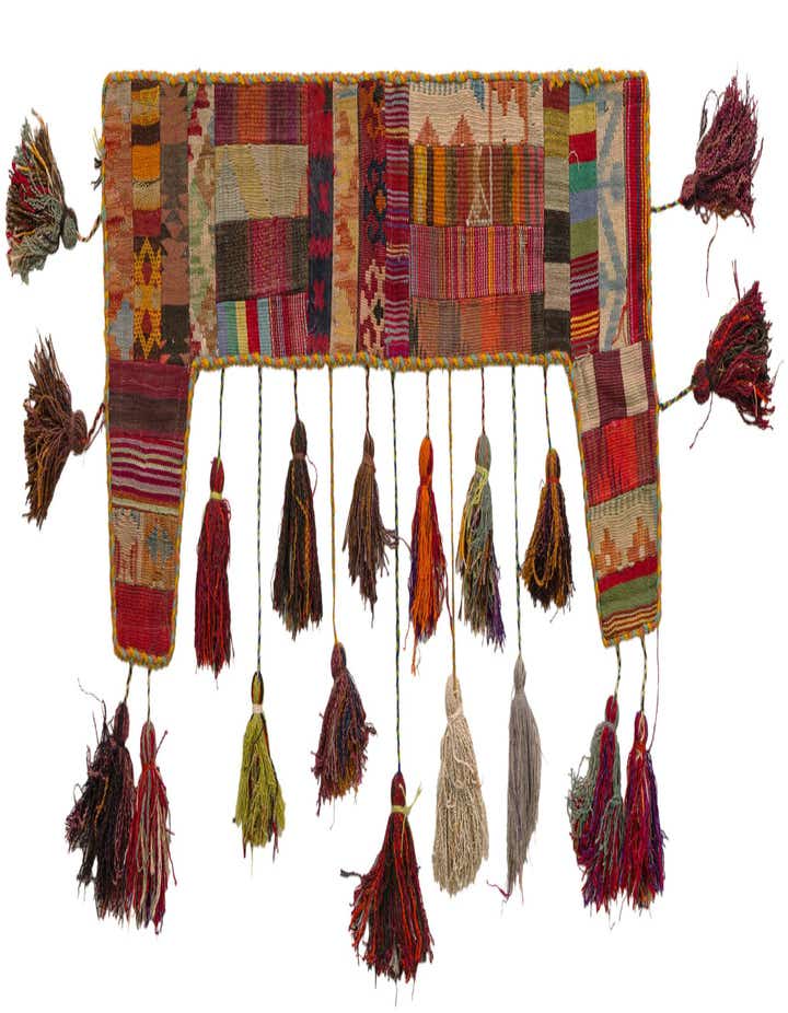 A vibrant, multi-colored 2x3 rectangular wool rug featuring an abstract patchwork design and decorative tassels.