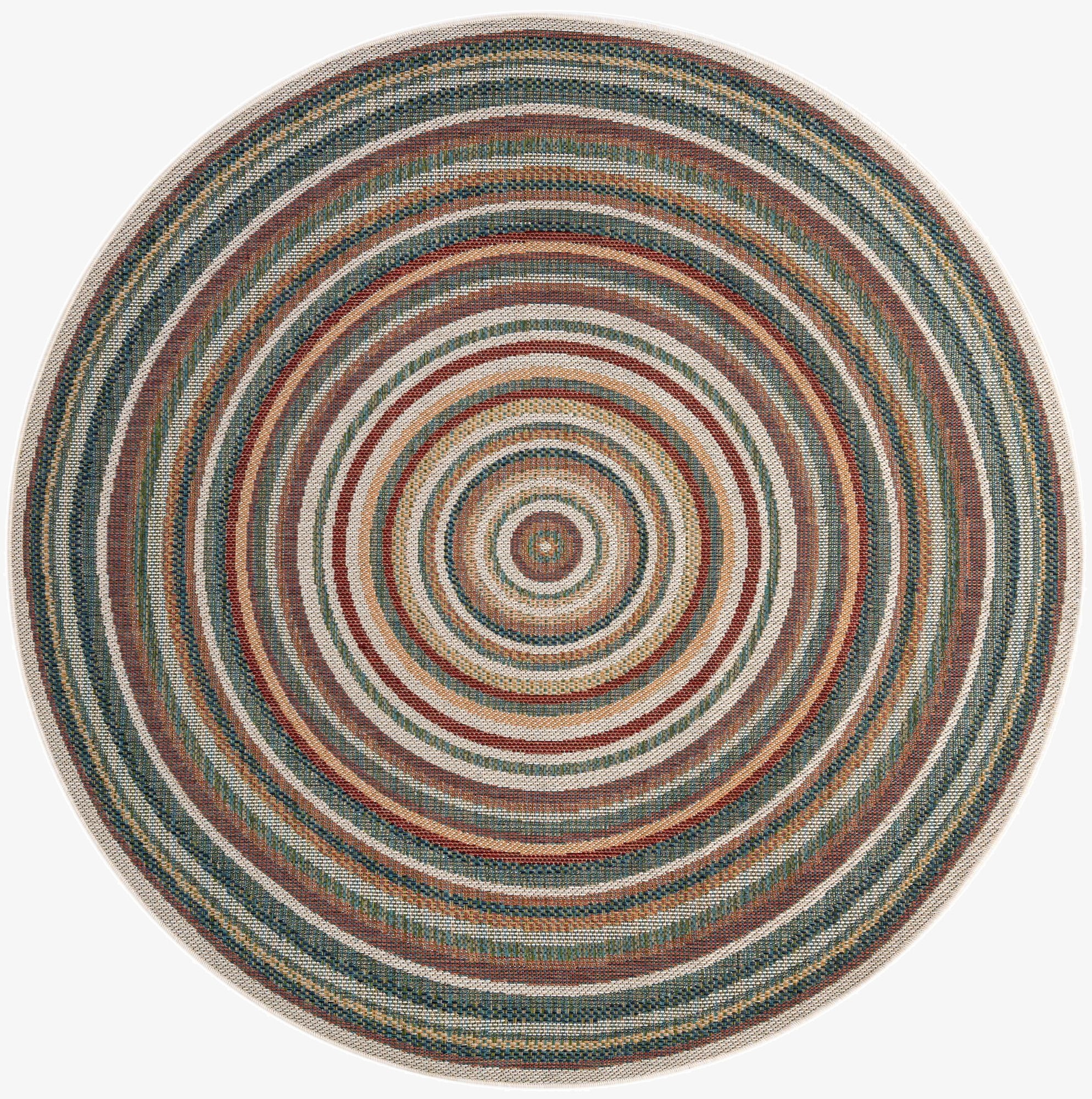 A 7' round multi-colored modern stripe rug, featuring concentric circles of various hues, suitable for indoor or outdoor use.