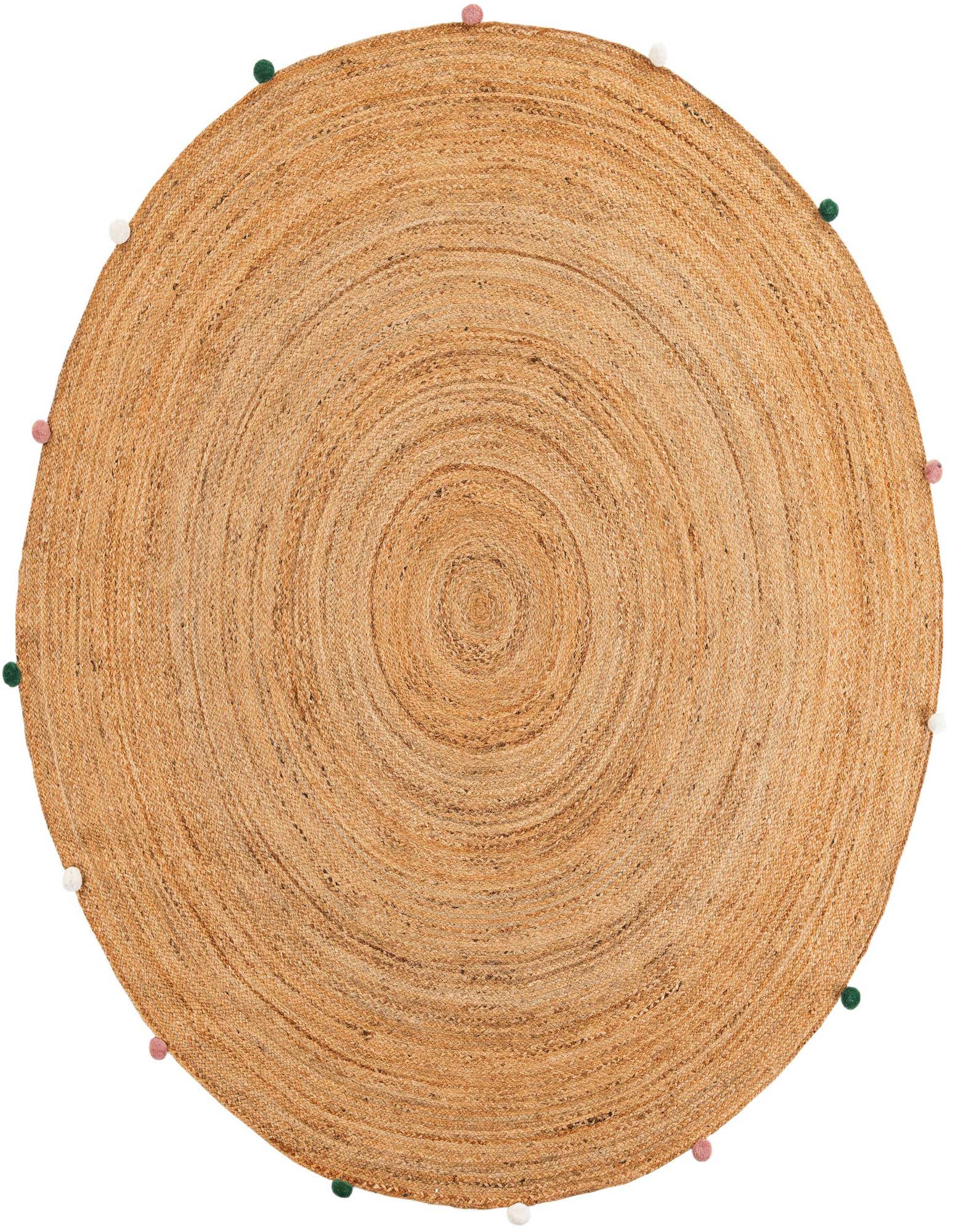 A round, braided jute rug with a natural tan color, featuring playful pink, green, and white pom-poms around its edge.