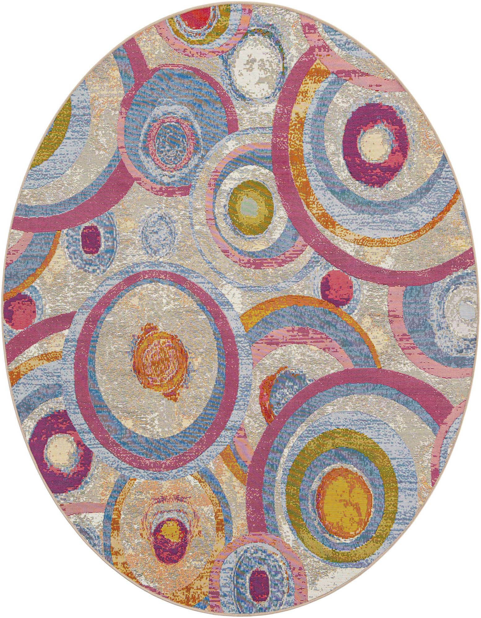 A vibrant 7' 10 round multi-colored modern abstract rug with concentric circles in blue, pink, orange, and green, suitable for a patio.
