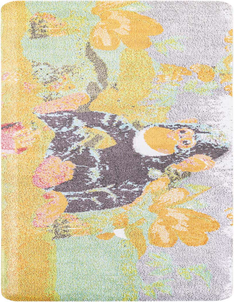 A multi-colored modern runner rug featuring abstract floral patterns in yellow, orange, pink, and light blue on a gray and green background.