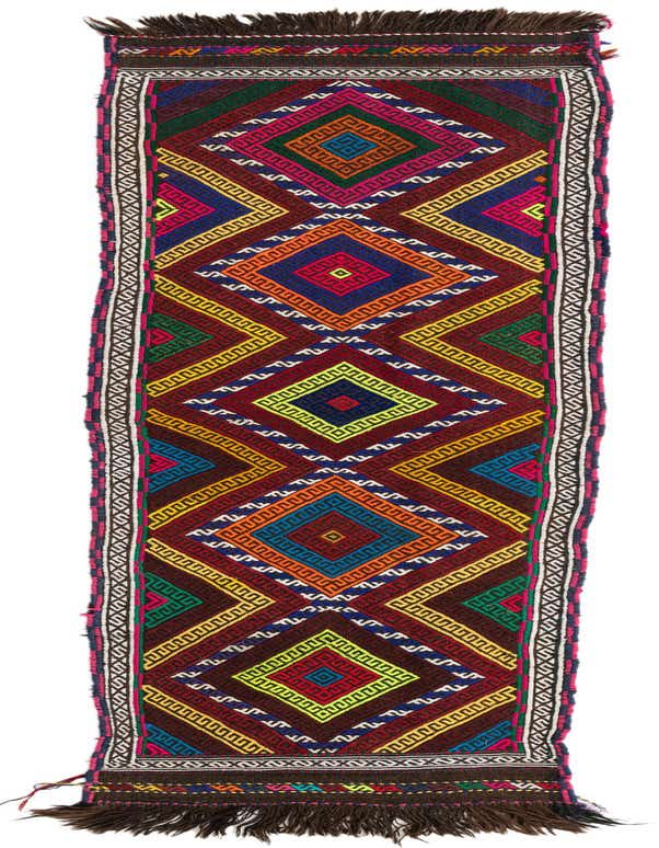 A vibrant 8 ft multi-colored wool runner rug with a tribal geometric pattern, featuring diamonds and zigzags, suitable for a hallway or kitchen.