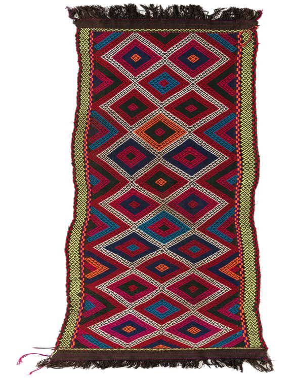 A vibrant 12 ft Kilim Fars runner rug with a multi-colored geometric diamond pattern and fringed ends, ideal for hallways.