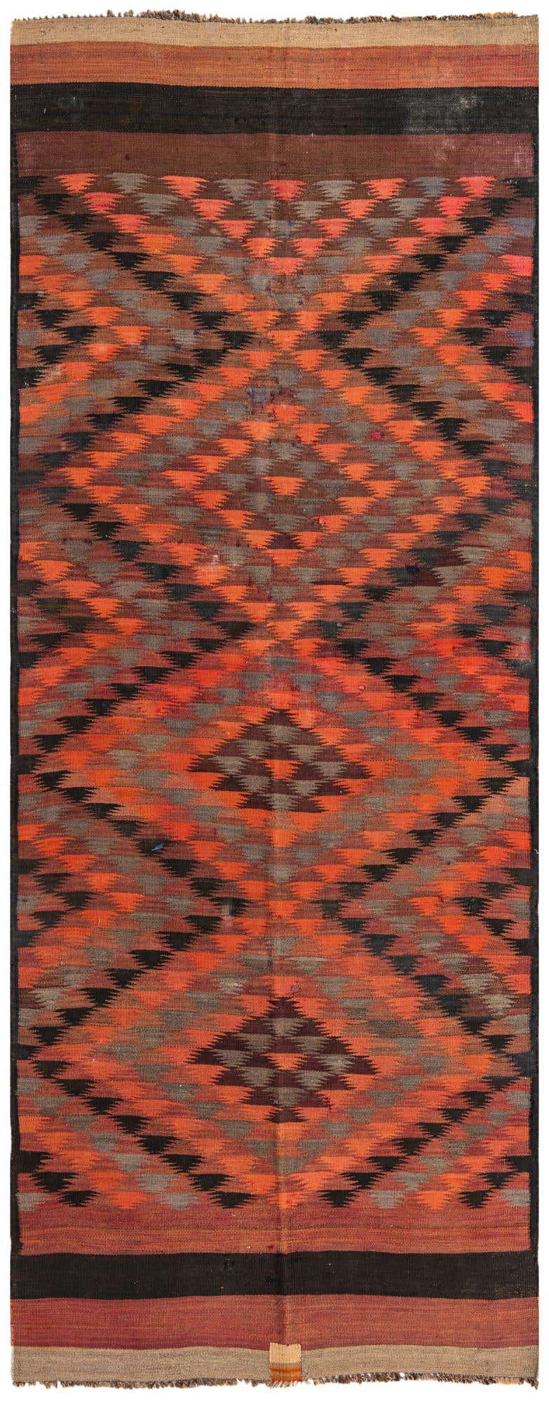 A vibrant 4x12 ft Kilim Fars runner rug with a multi-colored tribal geometric pattern in shades of orange, black, and brown.