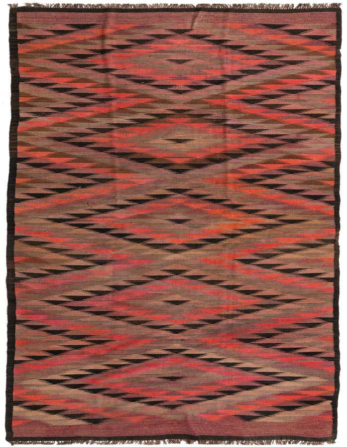 A 14 ft multi-colored wool runner rug featuring a tribal geometric pattern in shades of red, orange, brown, and black.