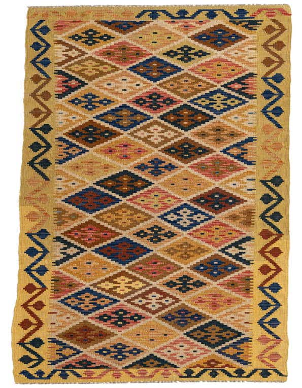 A 10 ft runner rug featuring a vibrant Southwestern tribal pattern with multi-colored diamonds and geometric motifs on a flatweave wool.