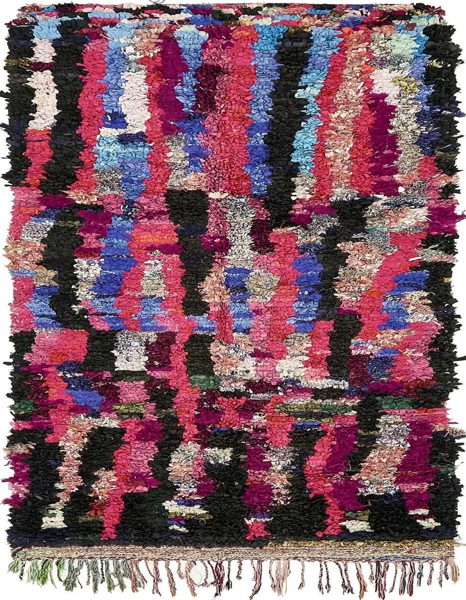 A vibrant 9 ft runner rug with a shag pile, featuring a multi-colored abstract pattern of pink, blue, and black stripes, ideal for a hallway.