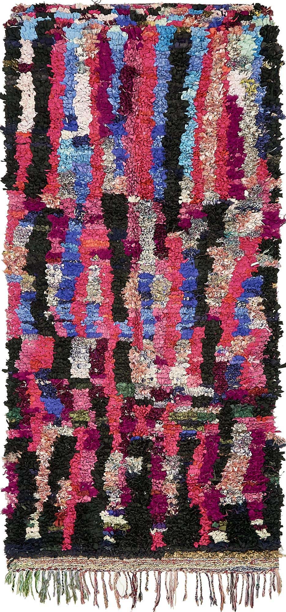 A vibrant 9 ft runner rug with a shag pile, featuring a multi-colored abstract pattern of pink, blue, and black stripes, ideal for a hallway.