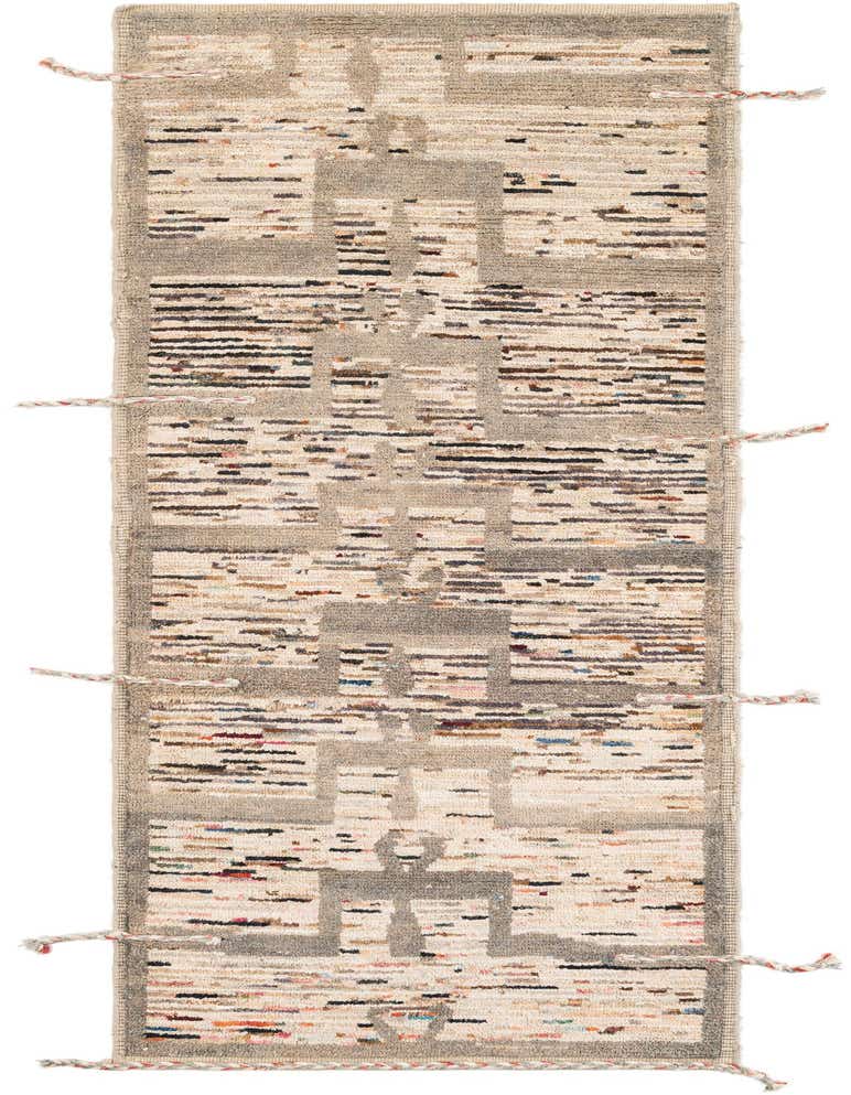 A 10 ft runner rug with a multi-colored tribal abstract pattern on a light background with gray geometric shapes, ideal for a hallway.