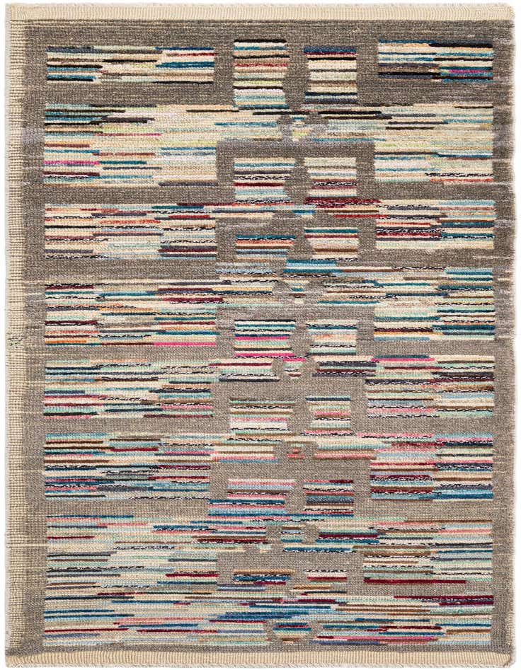 A handmade 8 ft runner rug with a multi-colored tribal stripe pattern on a shag pile, ideal for a hallway.