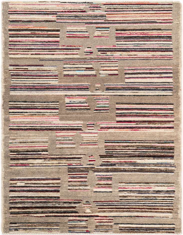 A multi-colored 8 ft runner rug with a tribal, modern, and oriental striped pattern on a shag pile.