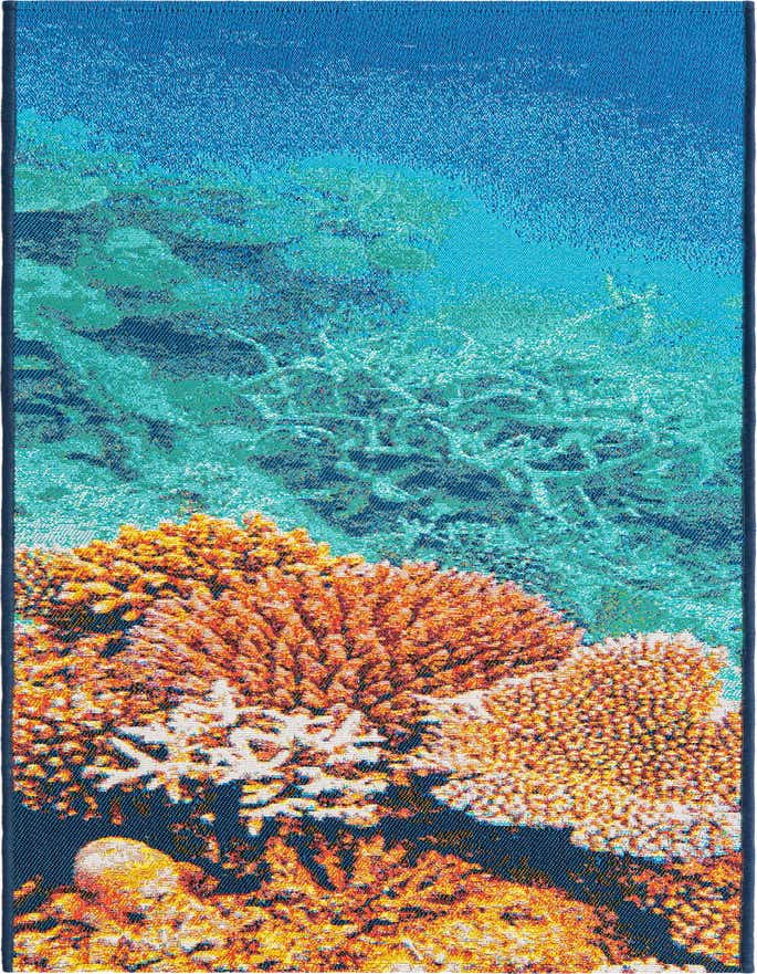 A 6 ft runner rug featuring a vibrant underwater coral reef scene with orange and white corals against a blue and teal ocean background.