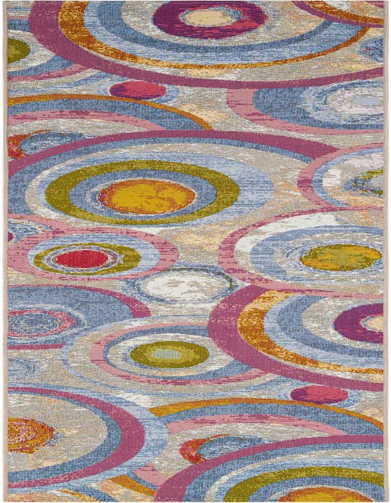 A 10 ft runner rug featuring a vibrant, multi-colored abstract pattern of concentric circles in blue, pink, yellow, and green.