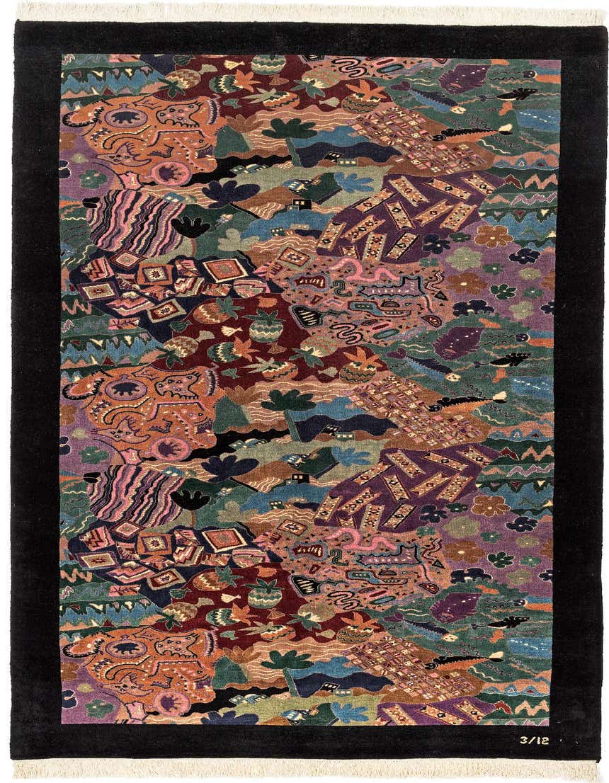 A 10 ft multi-colored wool runner rug with a modern oriental pattern, featuring various abstract shapes, animals, and geometric designs, framed by a solid black border.