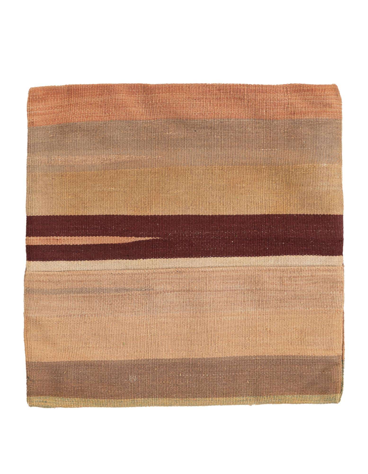A square, multi-colored wool rug featuring horizontal stripes in shades of brown, beige, and terracotta, with a prominent dark brown stripe.