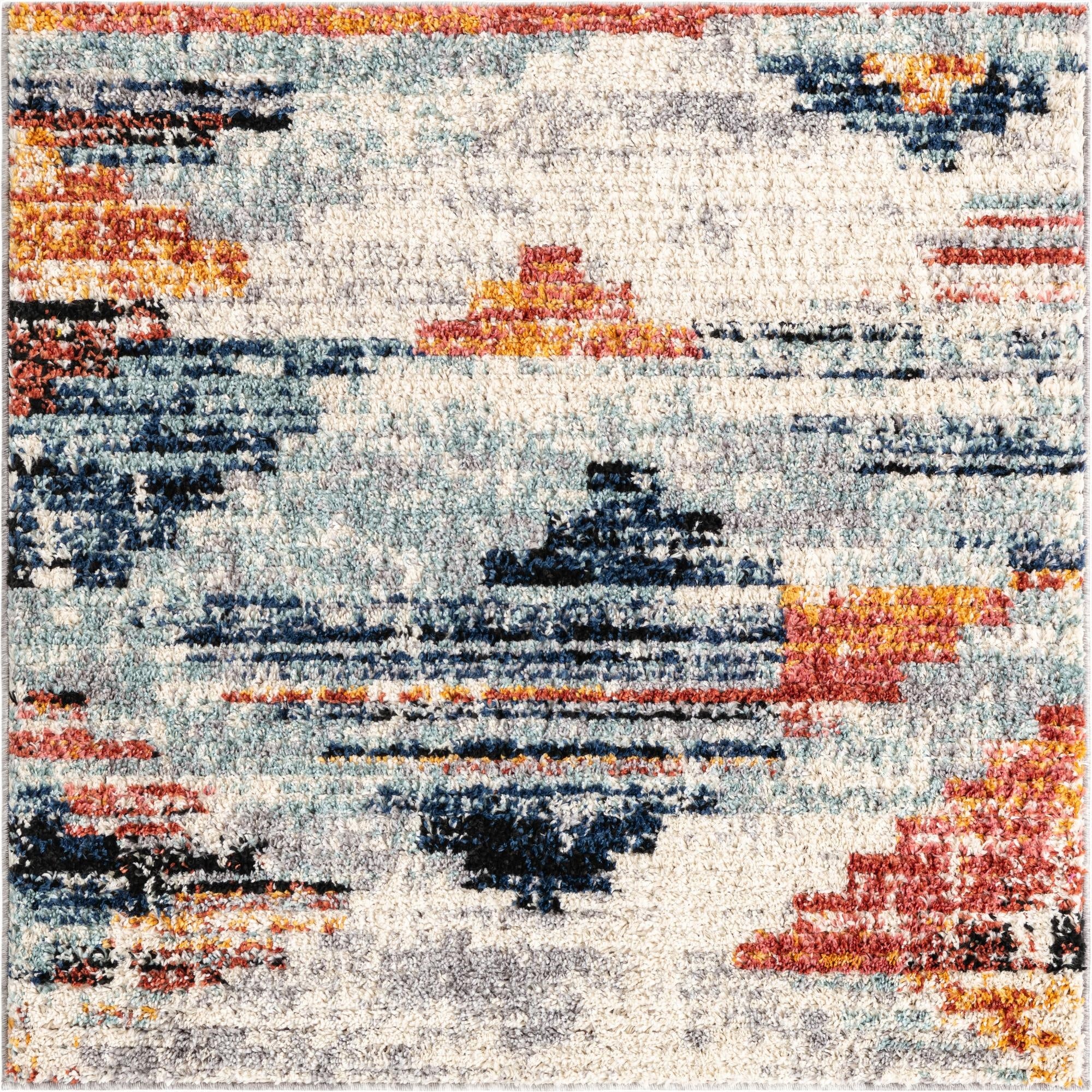A multi-colored square shag rug with an abstract modern pattern in shades of blue, orange, red, and cream.