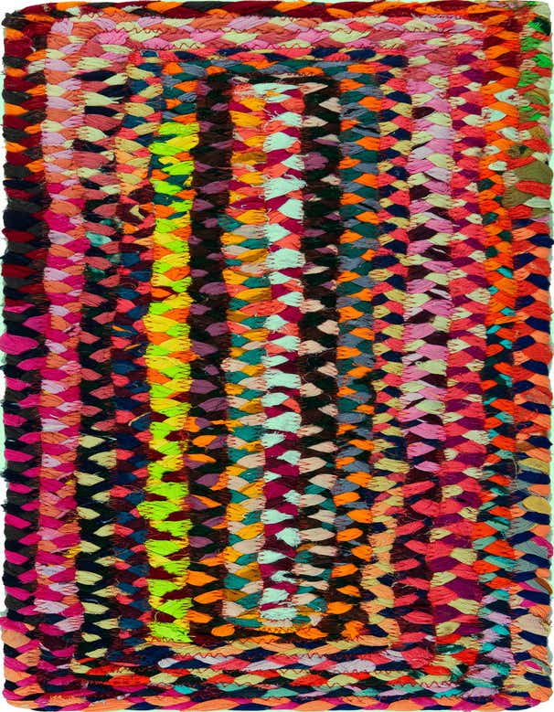 A vibrant multi-colored braided cotton stair rug with a textured, flatweave construction, featuring a mix of bright hues like pink, orange, green, and blue.
