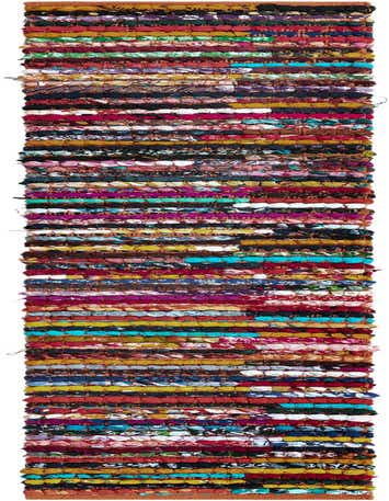 A long, narrow multi-colored Braided Chindi runner rug, 1' 2 x 8' 0, featuring rows of varied fabric scraps in an eclectic, textured stripe pattern.