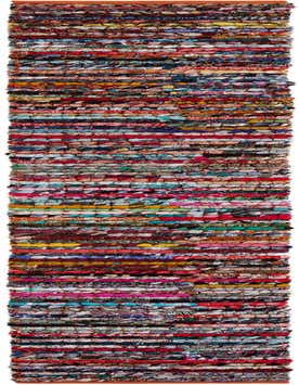 A long, narrow multi-colored braided chindi runner rug, handmade from recycled cotton, featuring horizontal stripes of various fabric scraps.