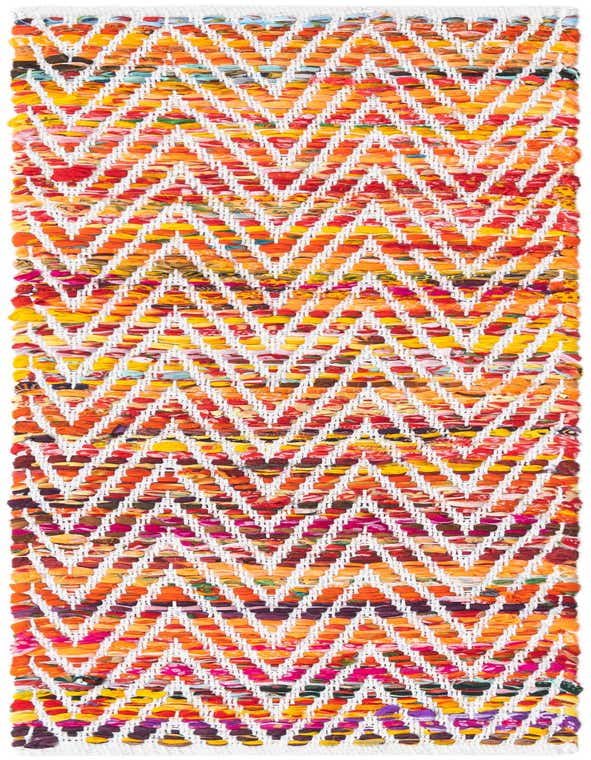 A vibrant multi-colored Chindi Chevron runner rug, handmade with a zigzag pattern of recycled cotton fabric strips on a white base.