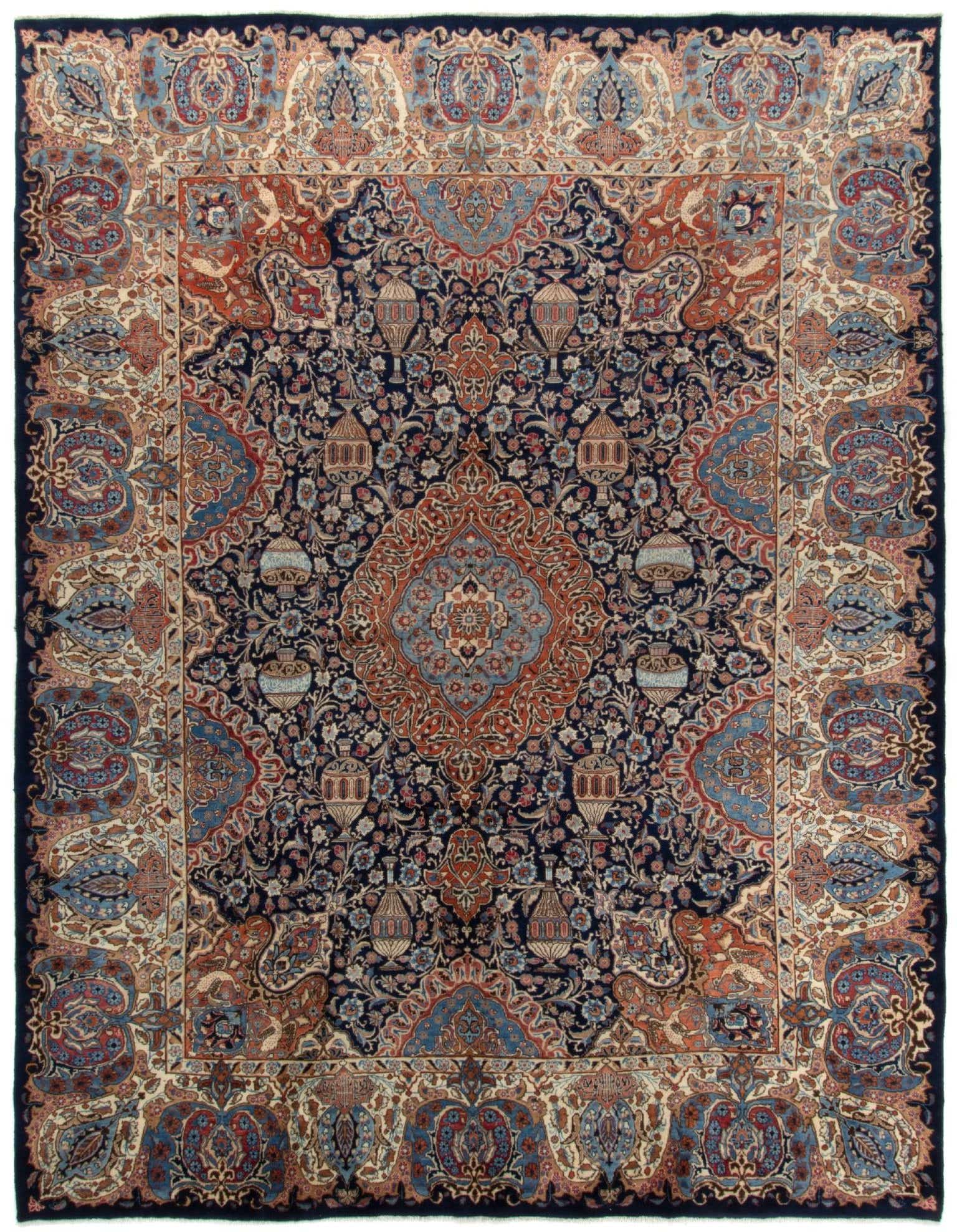 A 10x13 rectangular Persian Kashmar rug featuring a complex multicolor floral and medallion pattern on a dark blue field with an elaborate border.