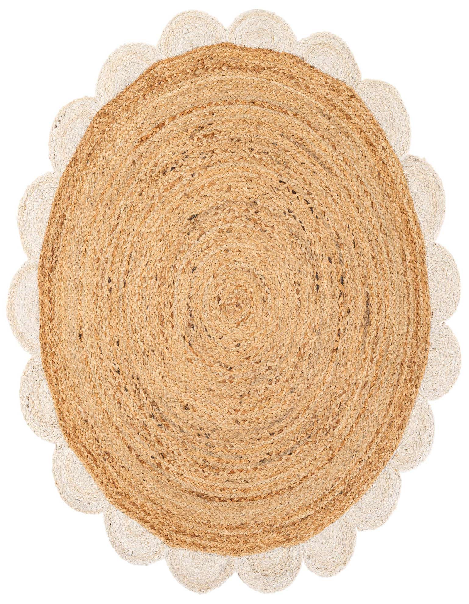 A round, natural jute rug with a scalloped ivory border, featuring a braided texture, perfect for a modern living space.