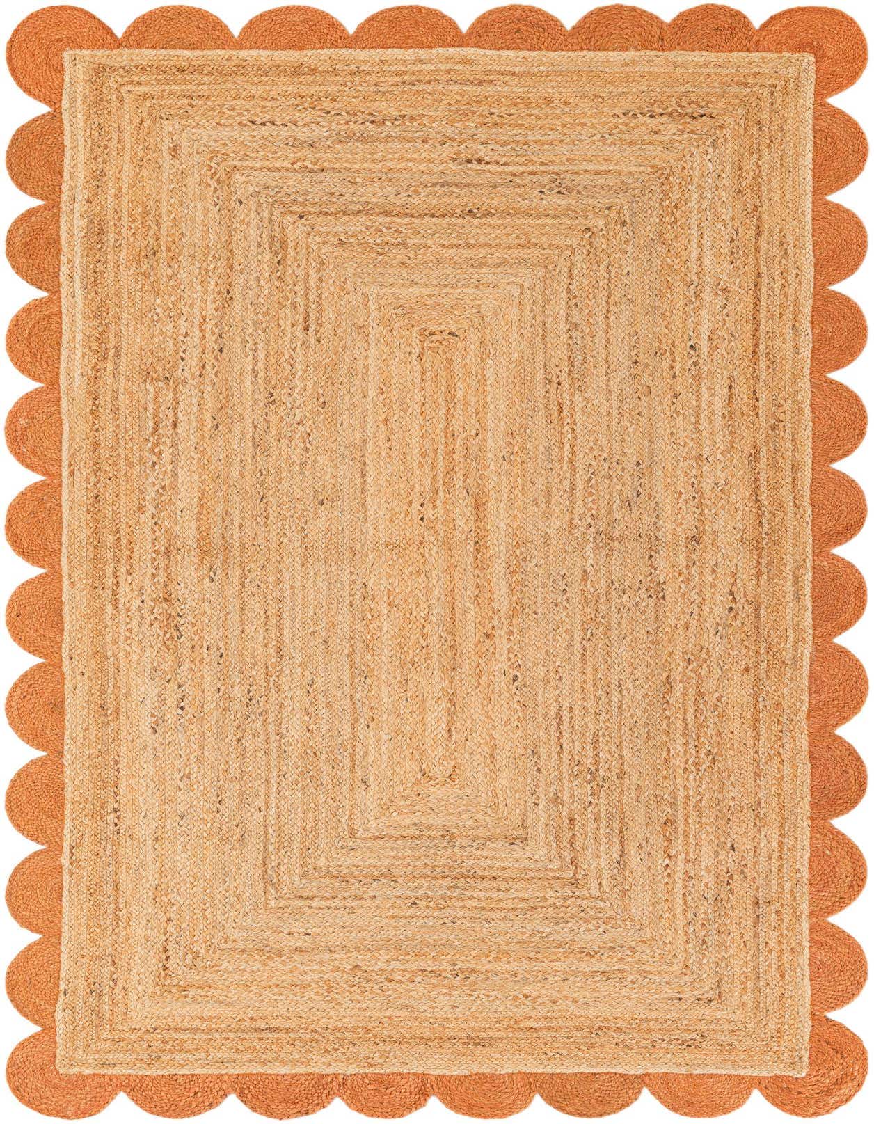 A 5x8 rectangular natural jute area rug with a distinctive terracotta scalloped border, perfect for a living room.
