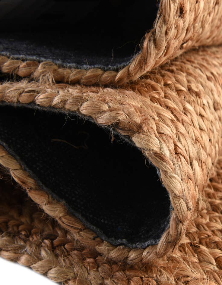 Detail image of  4' 1 x 6' 1  Hand Braided Jute Luxe Oval Rug