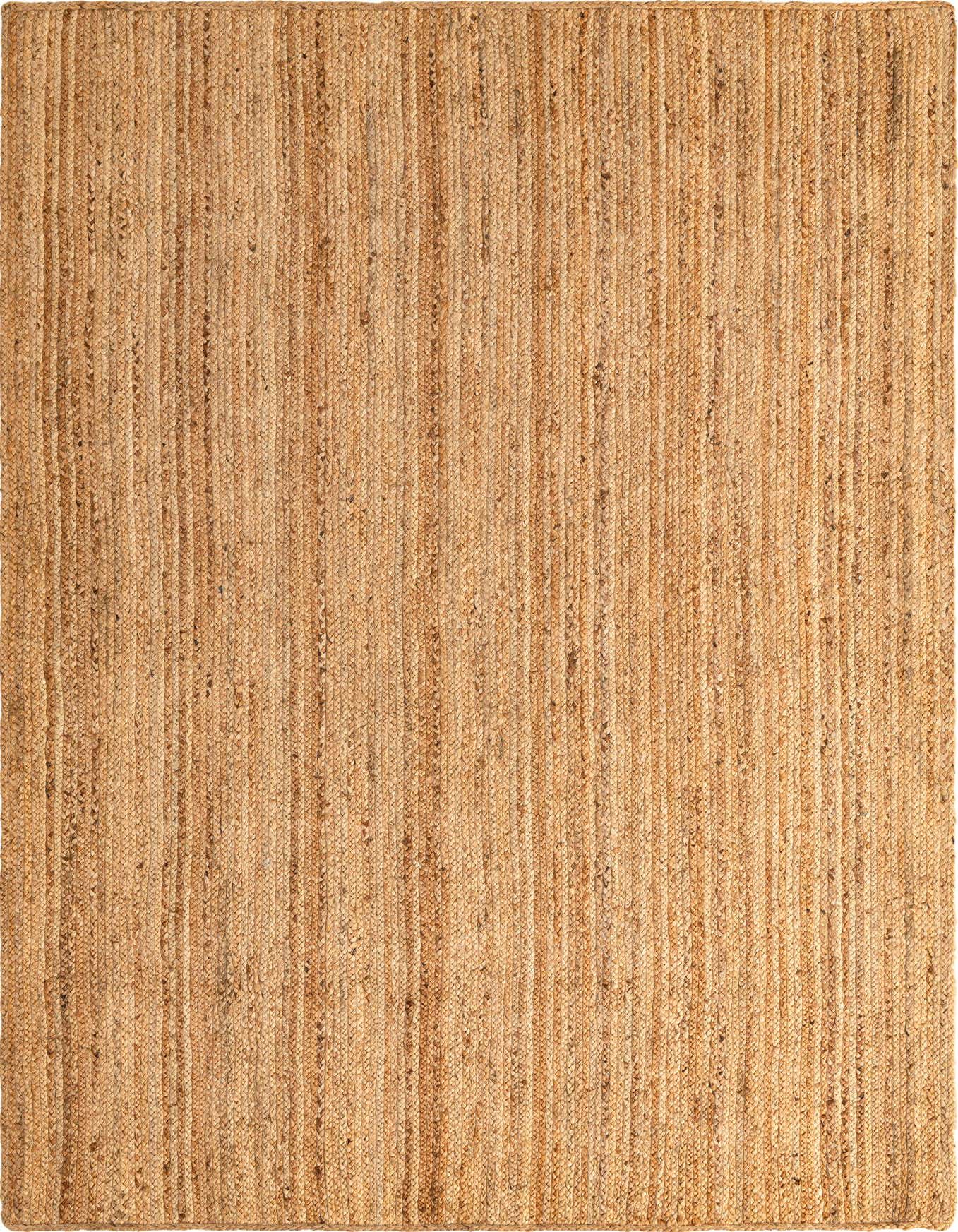 A 6x9 rectangular Braided Jute Luxe rug from Rugs.com, featuring natural brown and tan tones with a textured, solid flatweave pattern, perfect for a coastal or modern living room.