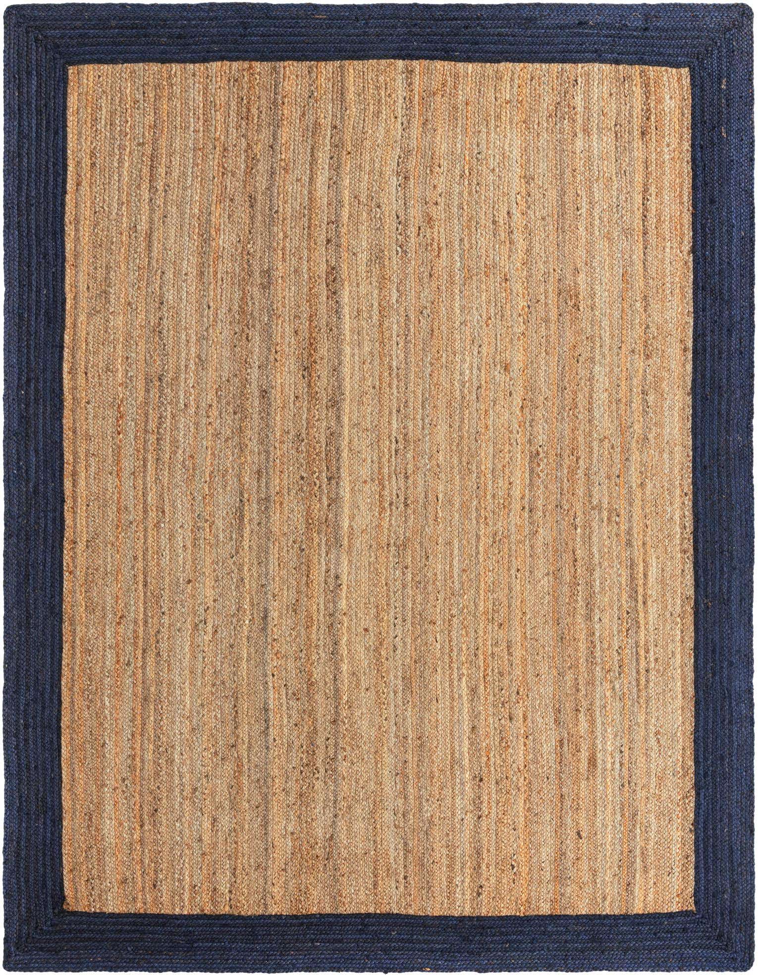 A 9x12 rectangular natural jute rug with a wide, solid navy blue braided border, showcasing its textured flatweave.
