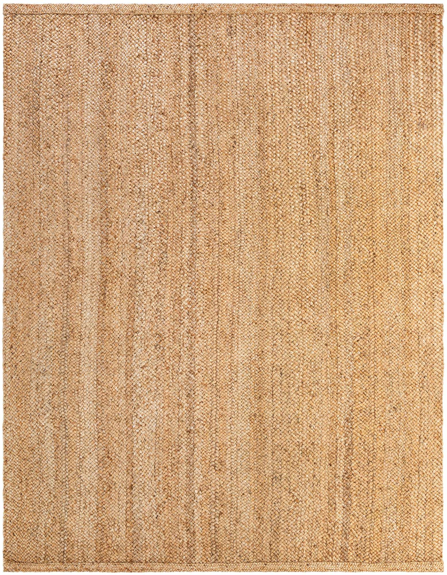 A 9x12 rectangular Heirloom Braided Jute rug in natural brown and tan tones, featuring a textured flatweave.