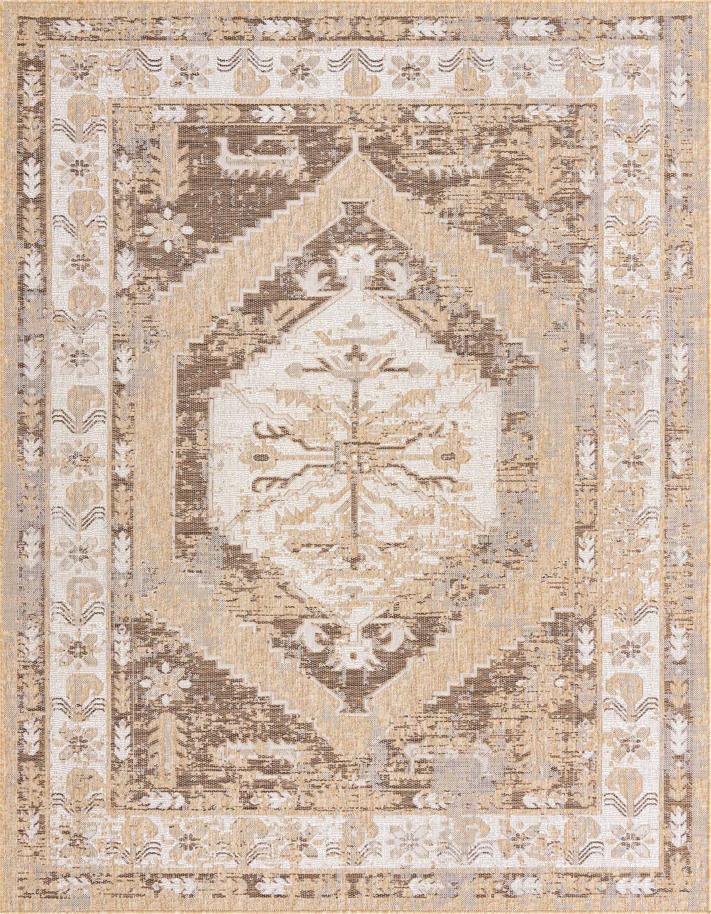 A 7x10 rectangular indoor/outdoor rug featuring a distressed Southwestern pattern in browns, tans, and creams.