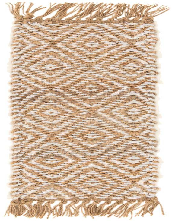 A 0' 9 x 2' 6 stair rug featuring a natural brown and ivory braided jute and cotton diamond pattern with fringed ends.