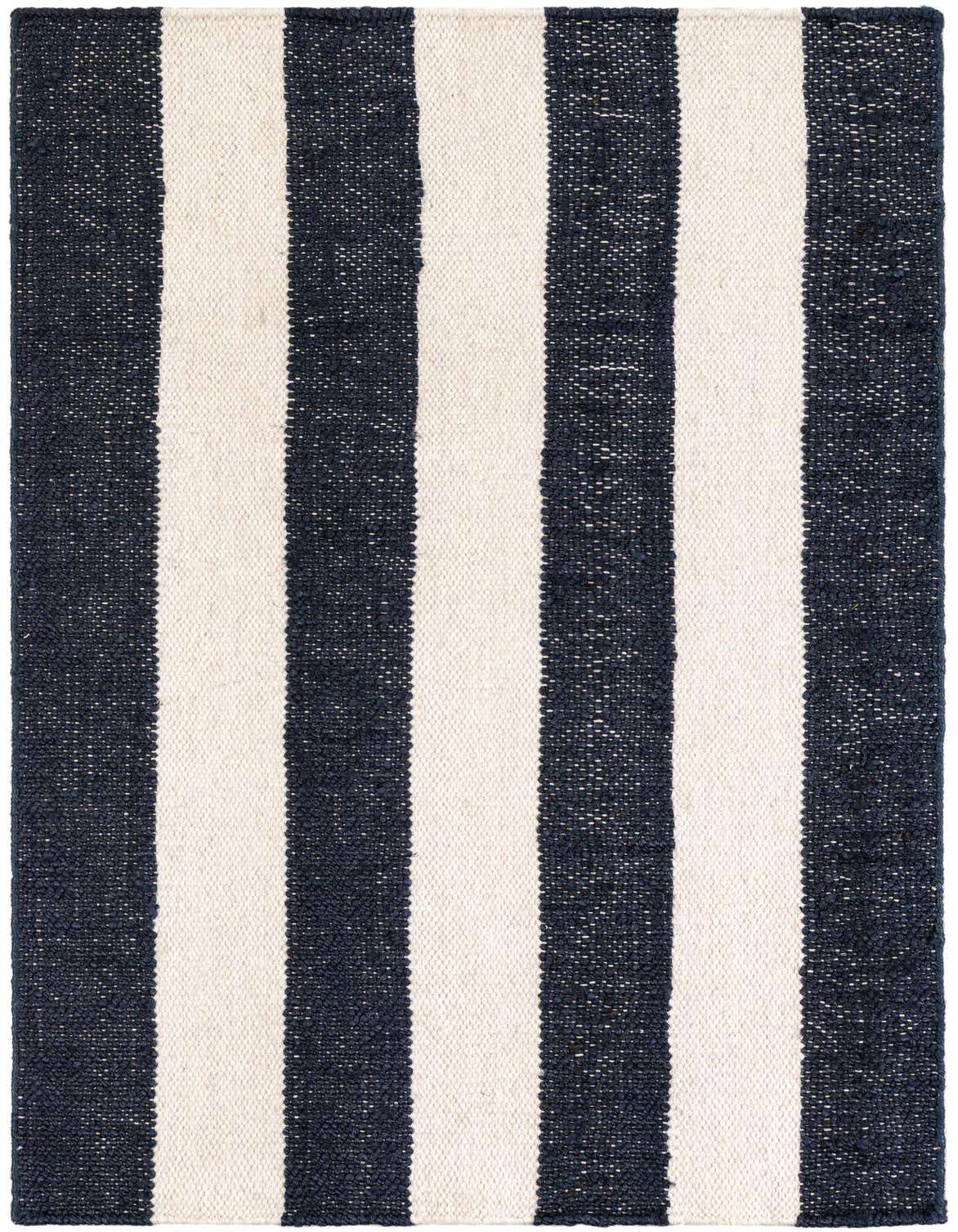 A 3x5 rectangular Jill Zarin Hamptons flatweave rug with wide navy blue and cream vertical stripes.