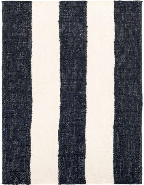 A 12 ft runner rug from the Jill Zarin Hamptons collection, featuring wide navy blue and cream stripes, ideal for a hallway.