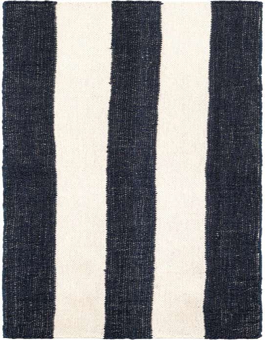 A Jill Zarin Hamptons 8 ft runner rug with bold navy blue and cream vertical stripes, showcasing its textured flatweave.