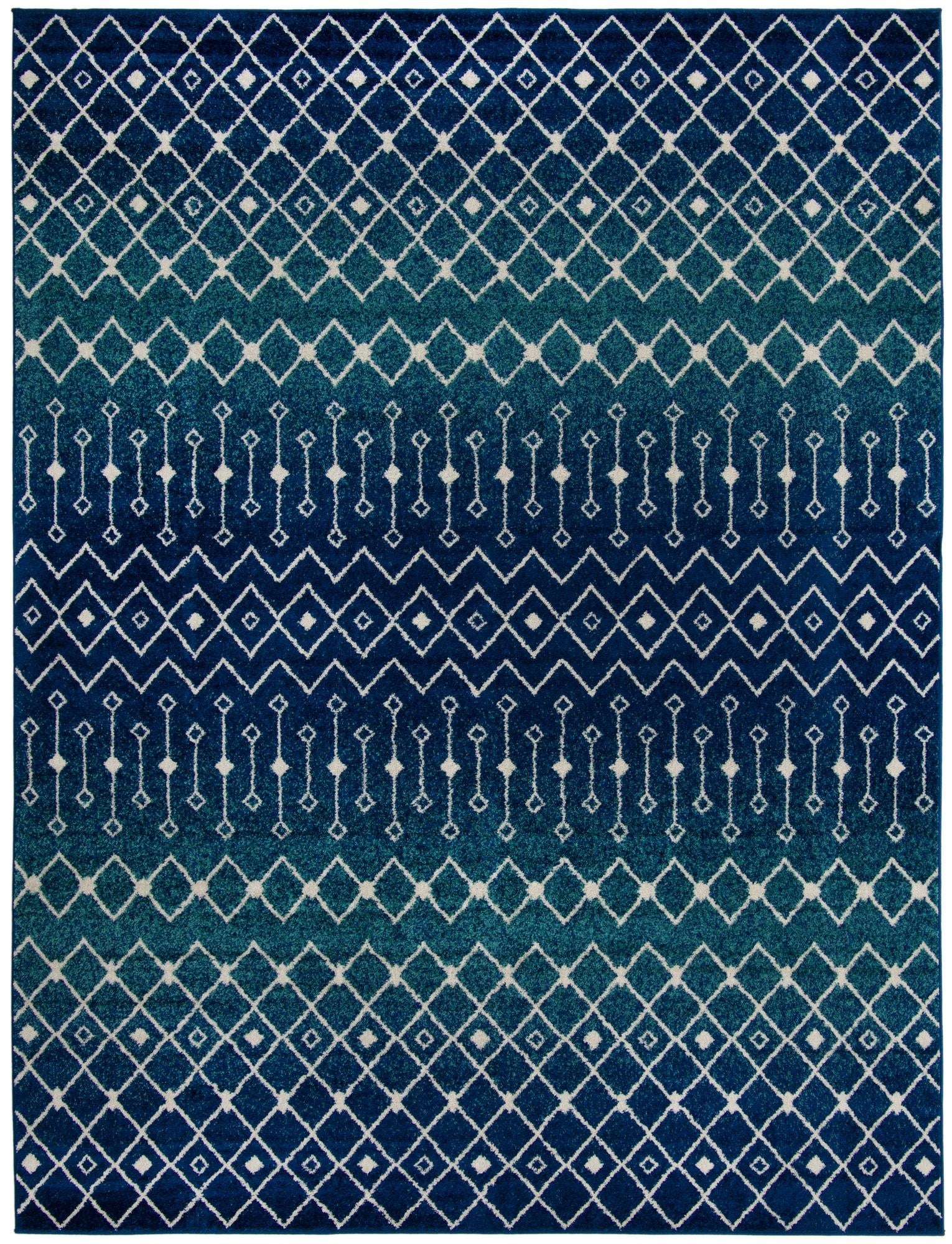 A 10x13 rectangular blue Moroccan Trellis rug with a faded, distressed bohemian pattern in varying shades of blue and white.
