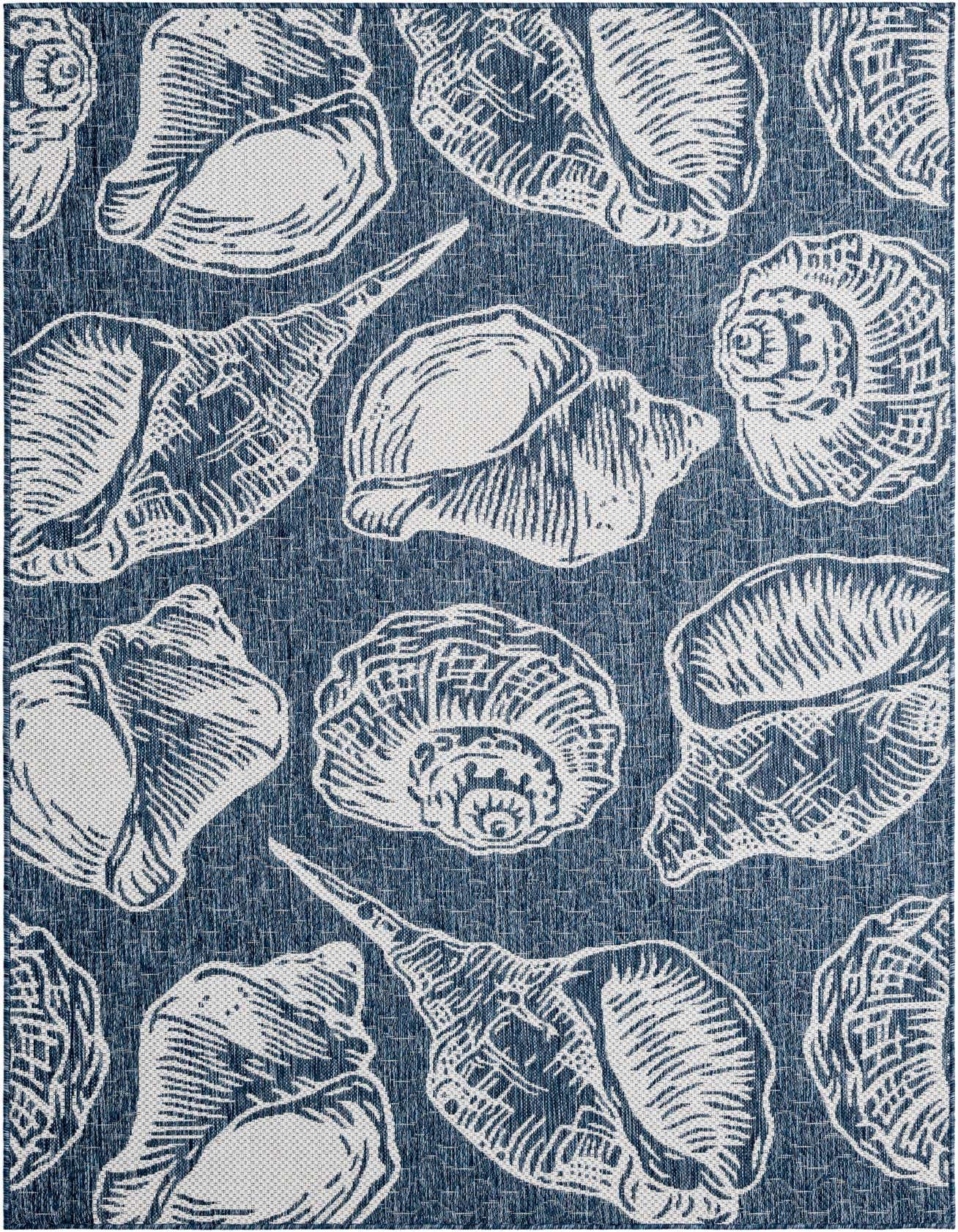 A 5x8 rectangular indoor/outdoor rug with a modern coastal pattern of various white seashells on a textured blue background.