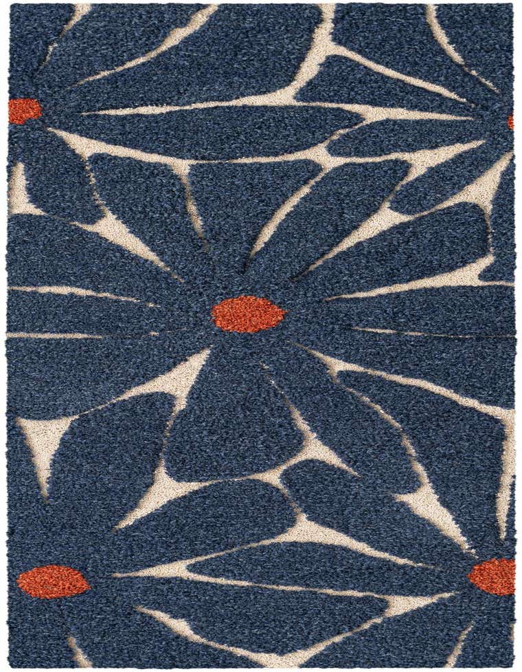 A close-up of a high-pile 8 ft runner rug featuring large, abstract blue floral shapes with orange centers on an ivory background.