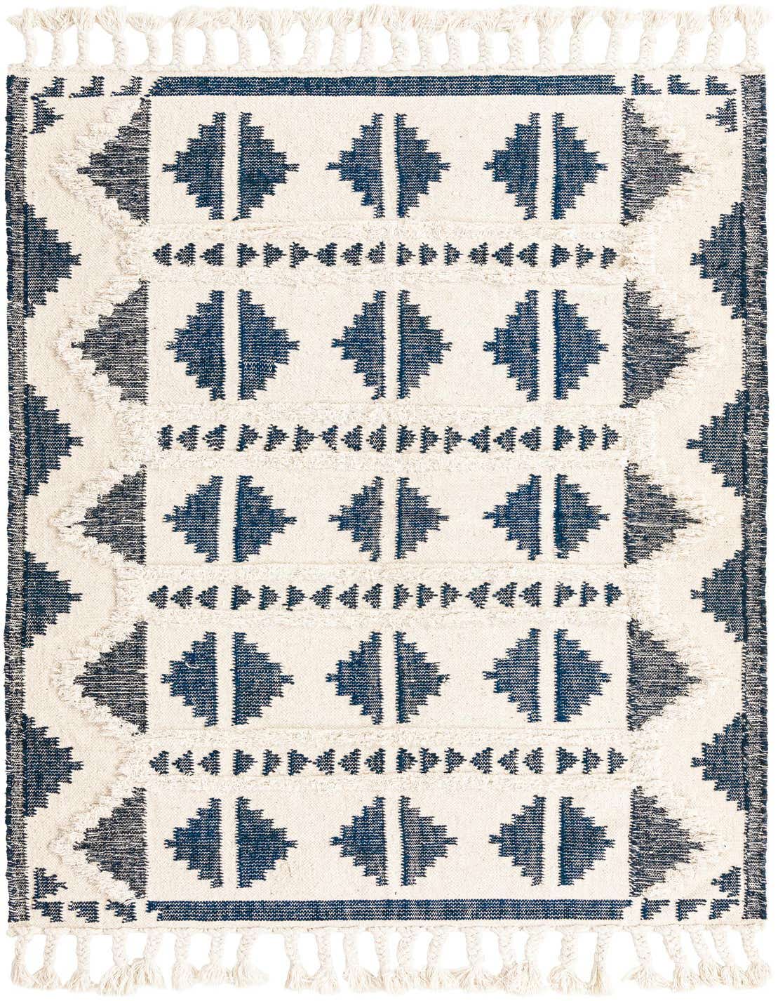 A 5x8 rectangular Arizona Collection wool rug featuring a modern tribal pattern in deep blues and off-white with shag texture and tassels.