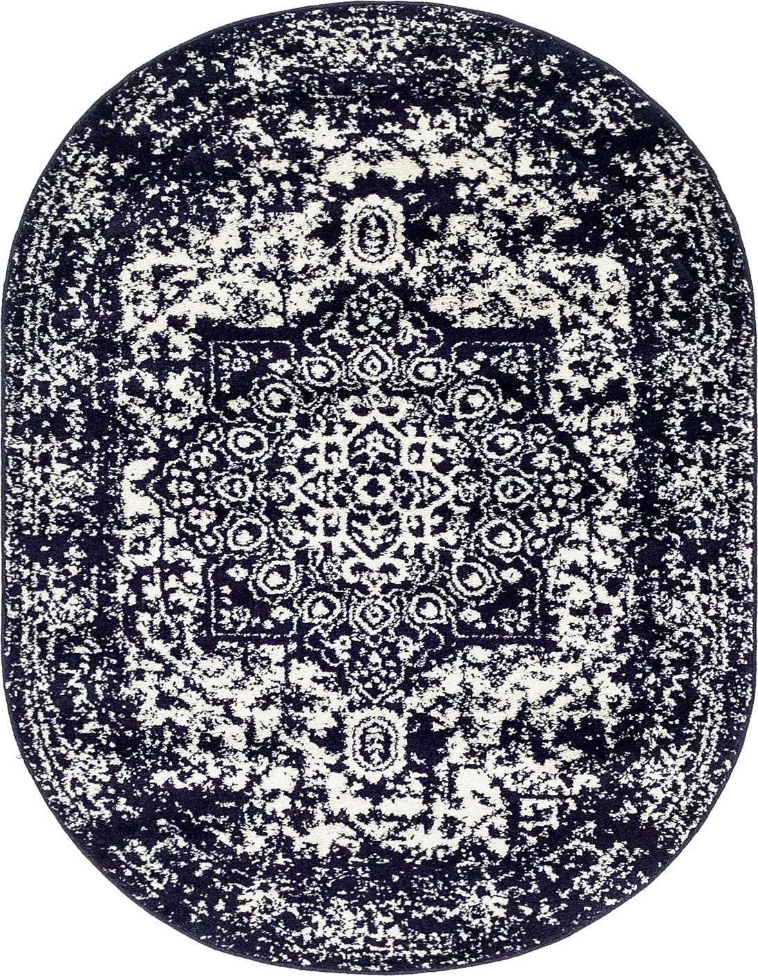 An oval navy blue and ivory rug with a distressed traditional medallion pattern, ideal for an indoor living space.