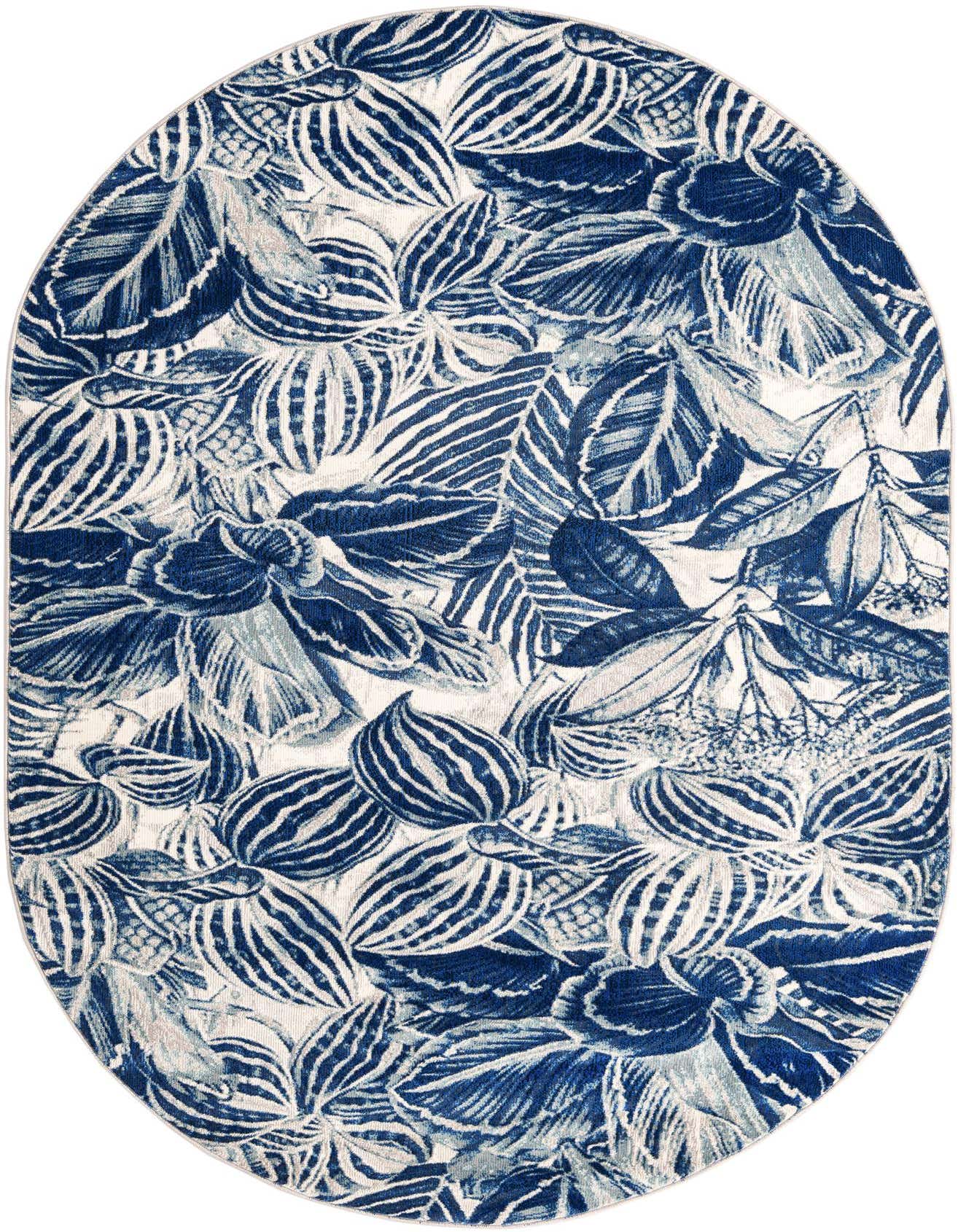 An oval 5' 3 x 7' 10 indoor rug featuring a modern botanical pattern with various shades of navy blue leaves on a white background.