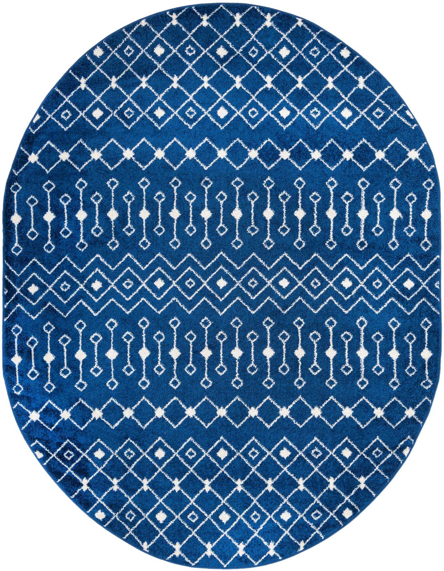 A 7'10 x 10'0 oval navy blue polypropylene rug with a white bohemian trellis pattern.