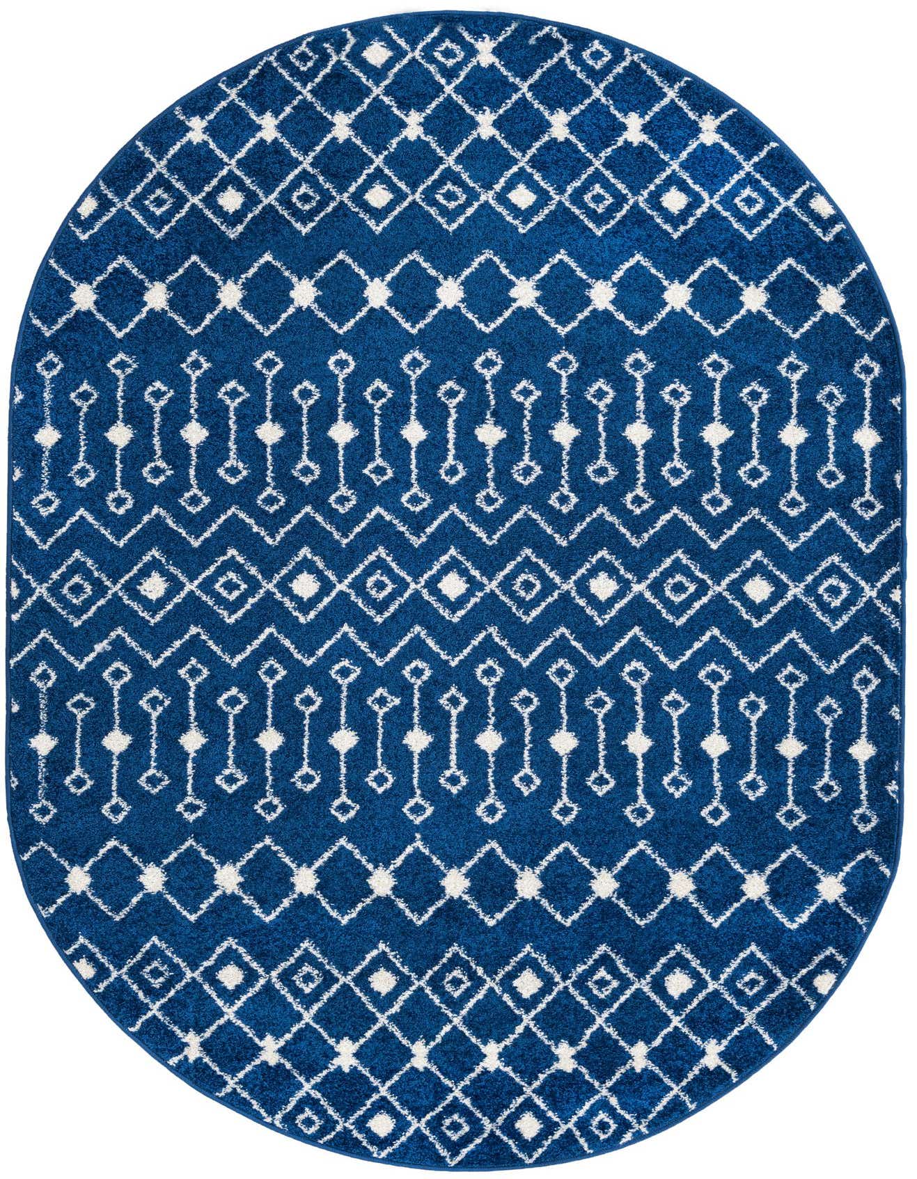 A 5' 3 x 8' 0 oval navy blue rug with a white Moroccan trellis and tribal pattern, suitable for an indoor living space.