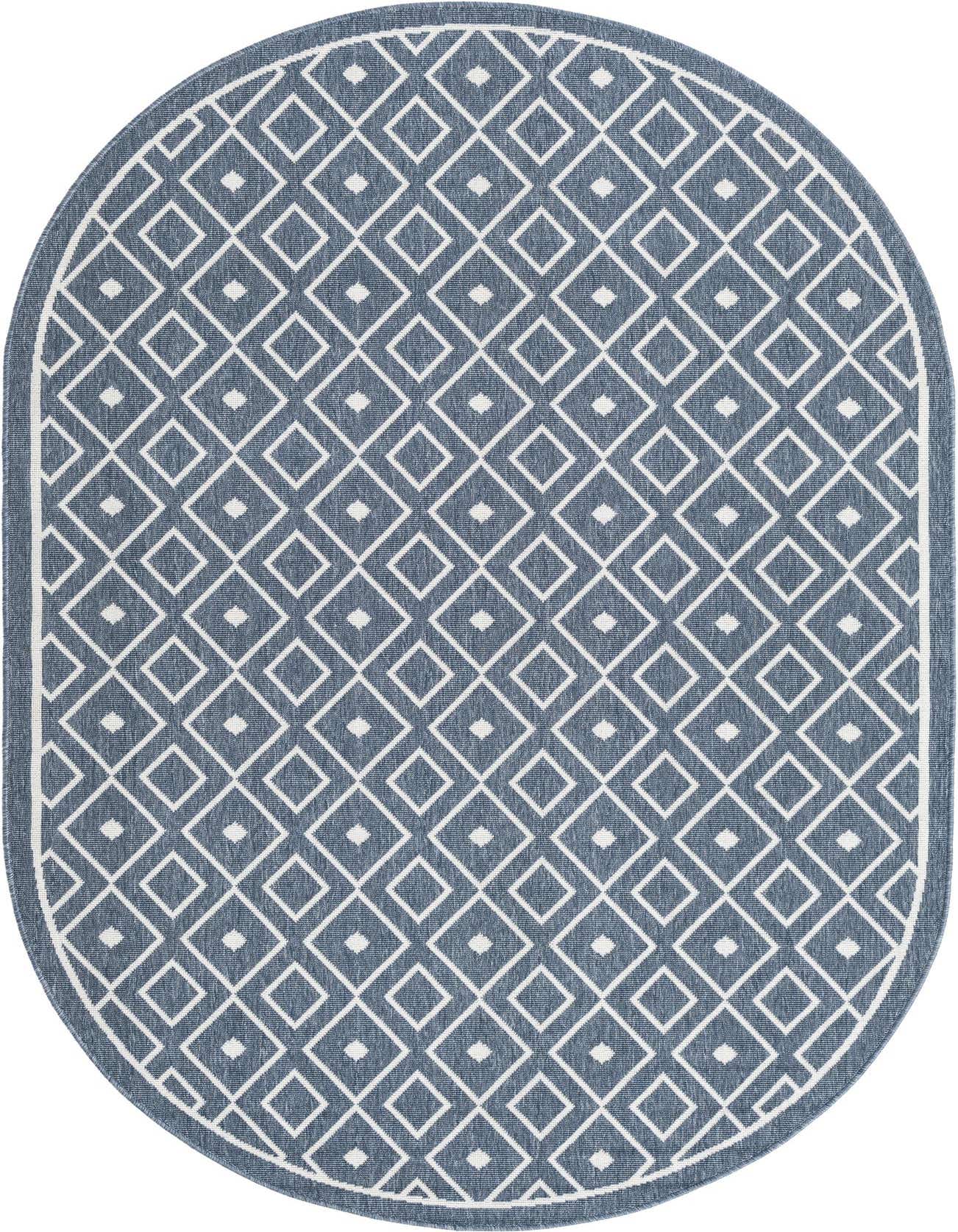 An oval 5'3" x 8'0" navy blue indoor/outdoor rug with a white geometric diamond pattern and flatweave texture.