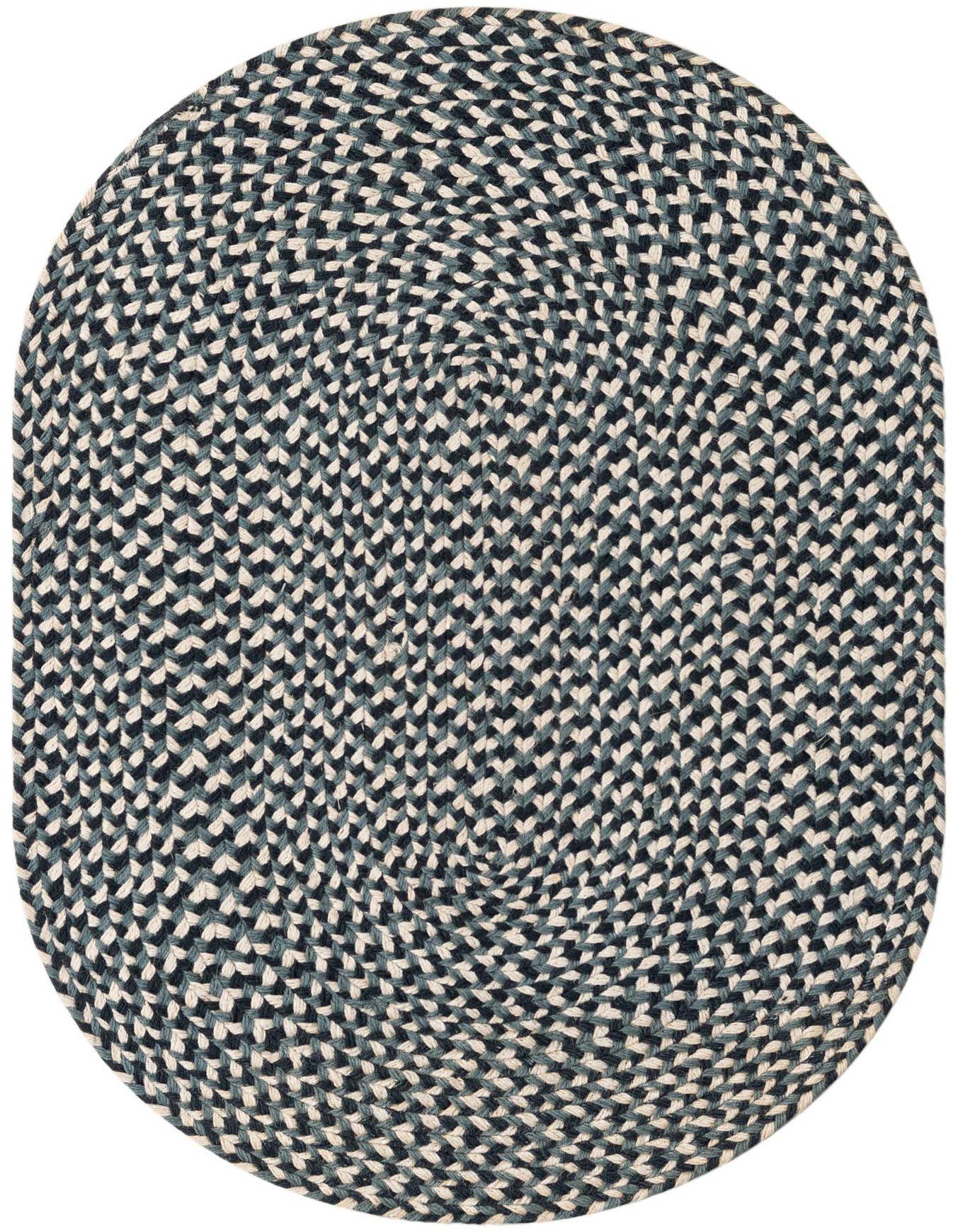 A 2' 0 x 3' 1 oval braided jute rug in shades of navy blue, light blue, and cream, featuring a modern, textured pattern.