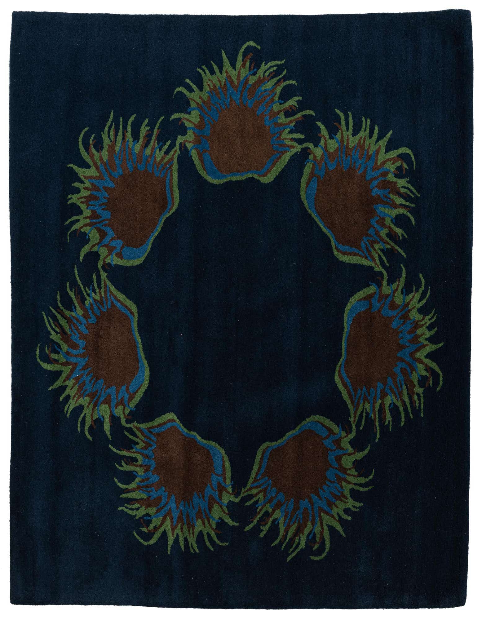 A 6x9 rectangular navy blue Agra rug with a central ring of abstract brown, blue, and green floral motifs.