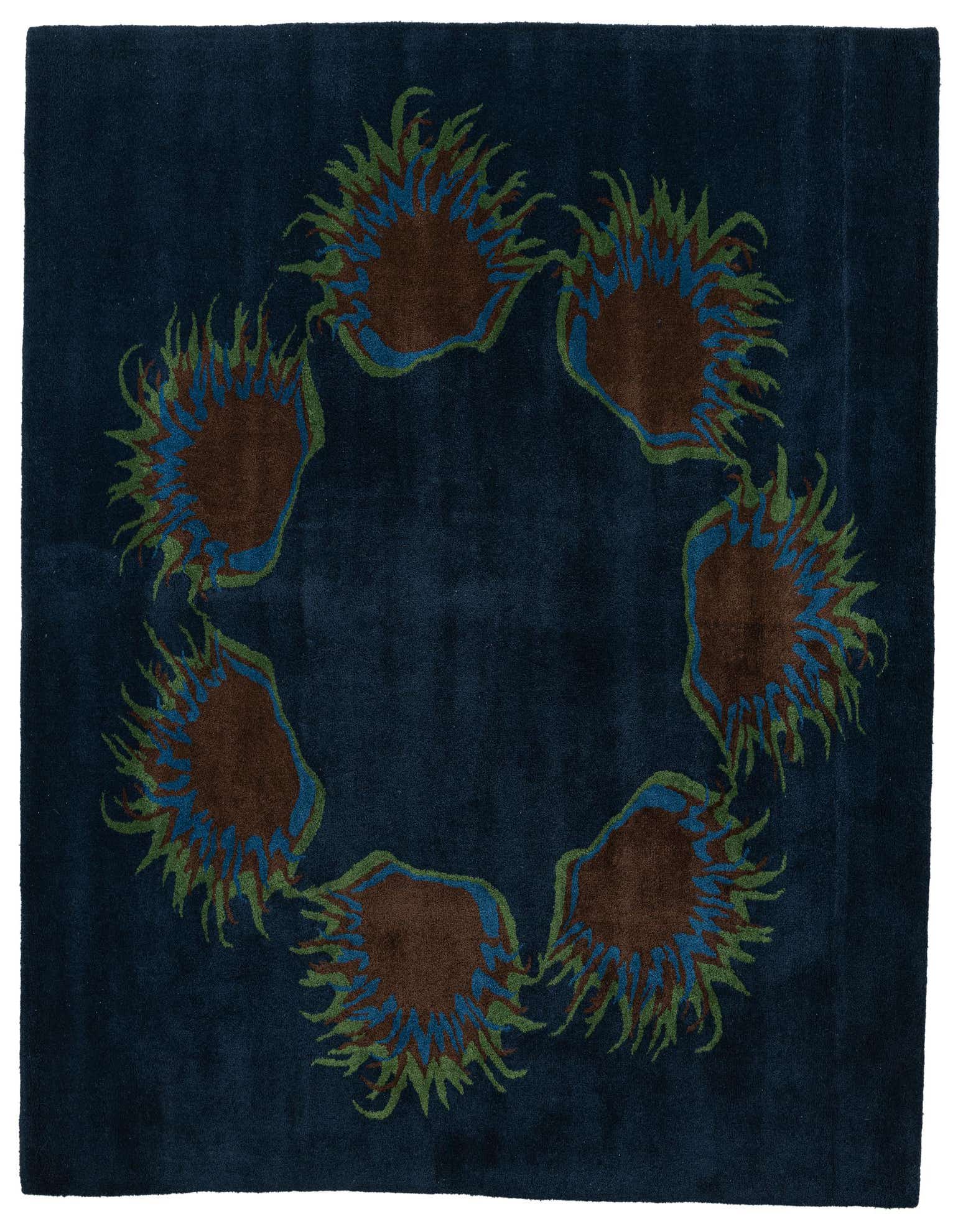 A 6x9 rectangular navy blue wool rug with a central ring of abstract brown, blue, and green floral motifs.