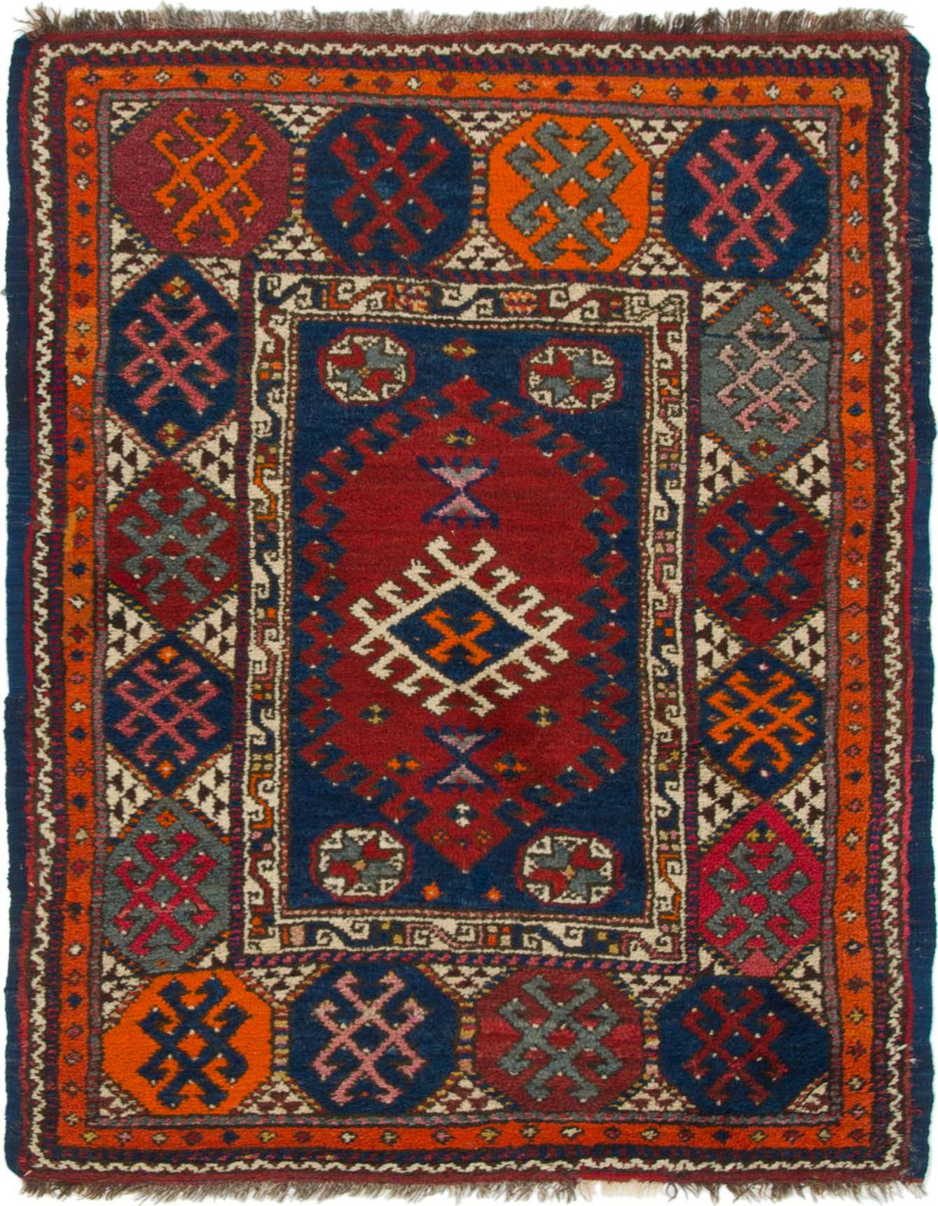 A 4x6 rectangular Anatolian wool rug with a traditional tribal pattern in deep blues, reds, and oranges, featuring a central medallion and intricate borders.