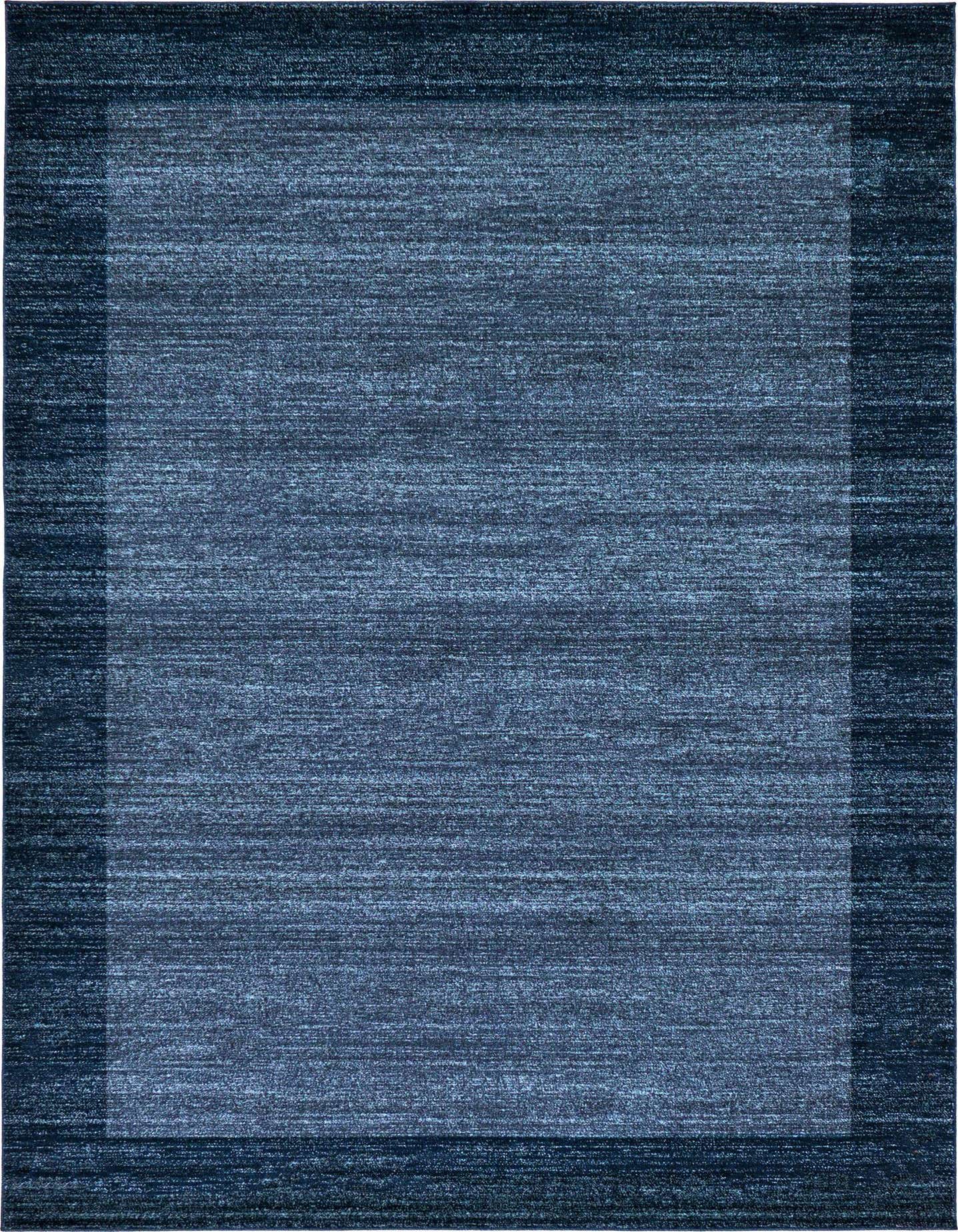 A 7x10 rectangular Angelica rug in varying shades of blue, featuring a subtle border and textured solid pattern, ideal for a living room.